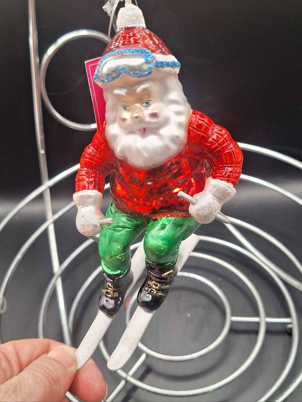 Christmas ornament features a unique design of a skiing Santa, Blown Glass